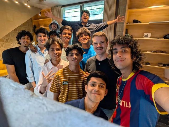 Cohort members gathered together inside the residency house